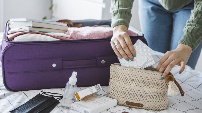 Person packing medicine bag