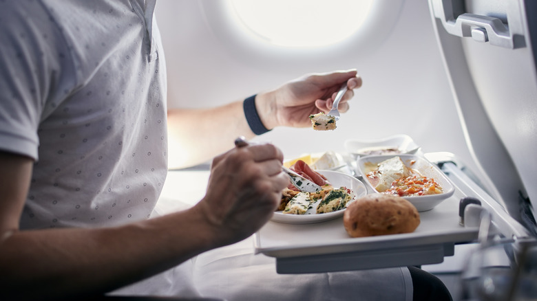 Person eating plane food