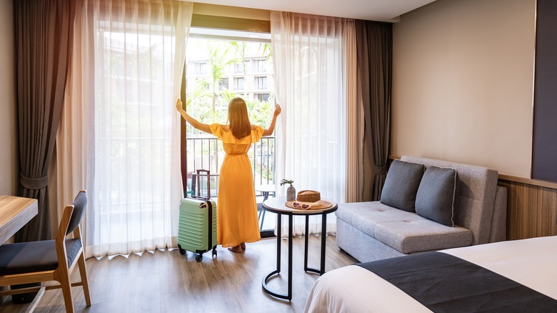 Woman traveler in hotel room