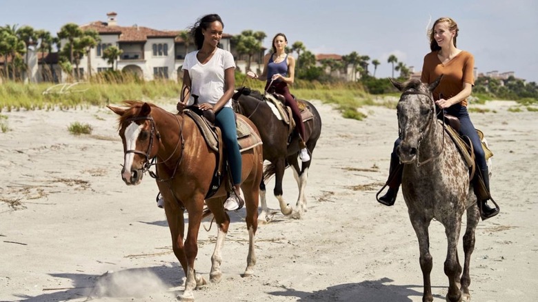 Three ladies on horseback at Sea Island Resorts