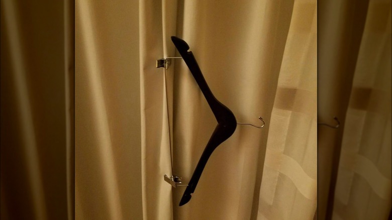 A clothes hanger on curtain