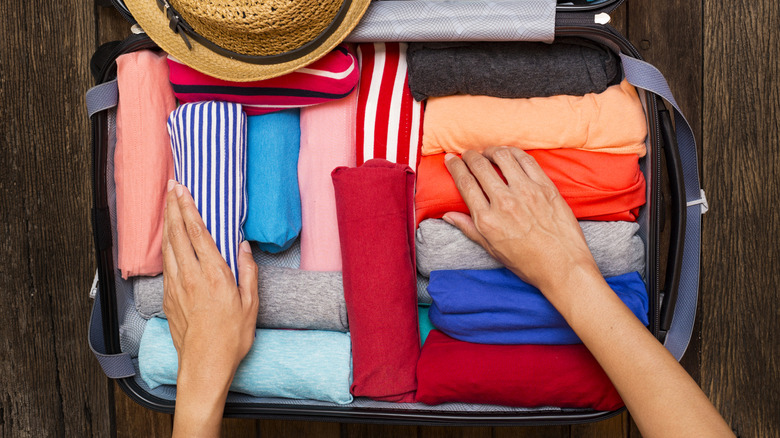 suitcase of bright clothes