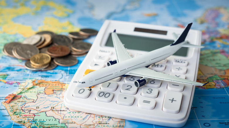 miniature plane on calculator and map