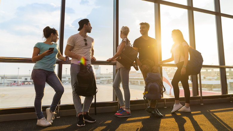 Airport passengers talking