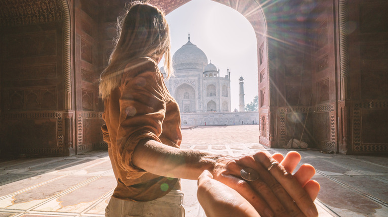 couple visiting Taj Mahal