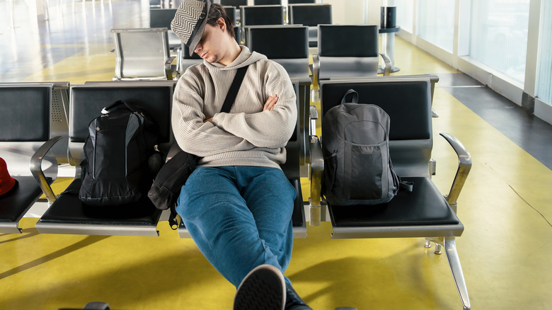 man at airport not paying attention