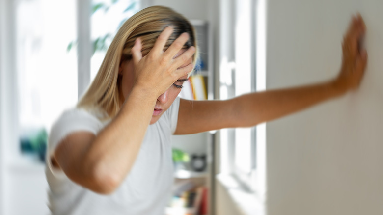 woman sick and dizzy