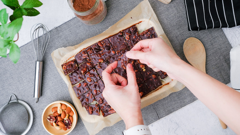 Hands breaking chocolate bark