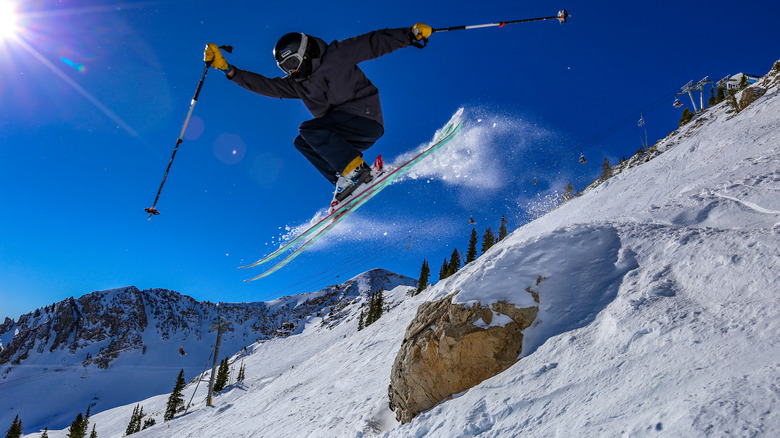 Jumping on skis at Alta
