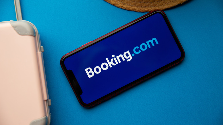 Booking.com logo on phone