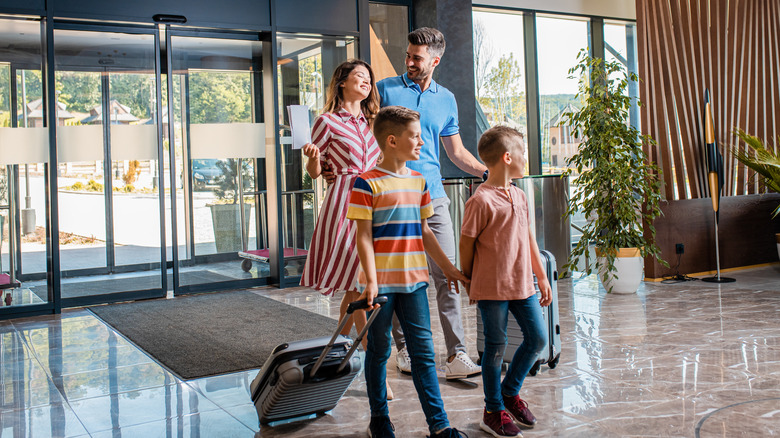 Family walking into a hotel