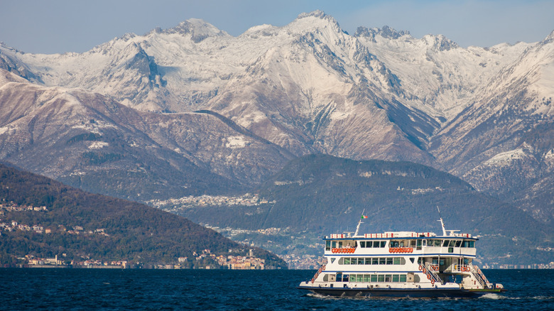 Ferry on Lake Como with winter mountains