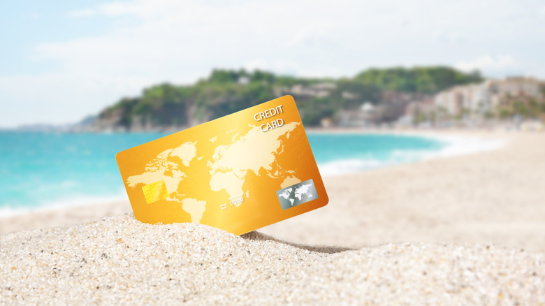 credit card on tropical beach