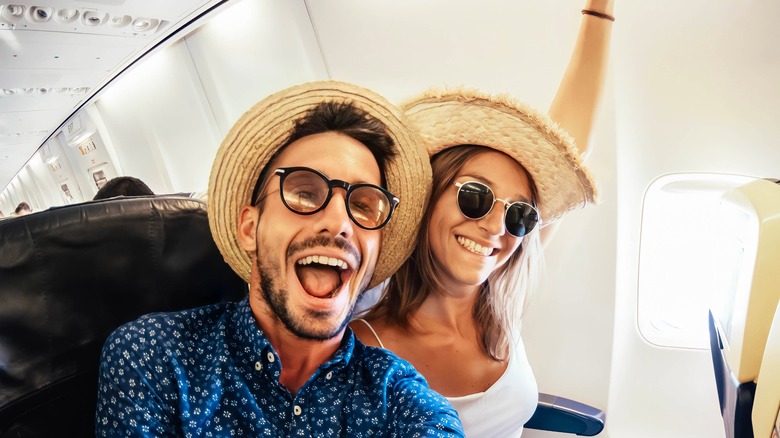 happy travelers on airplane