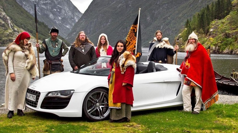 Viking cosplayers with an Audi