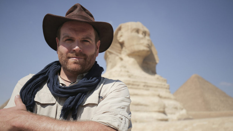 Josh Gates in front of the Sphinx