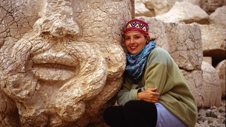 Justine Shapiro by an ancient statue