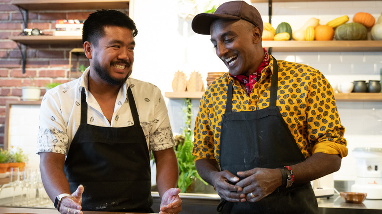 Marcus Samuelsson speaks with a cook