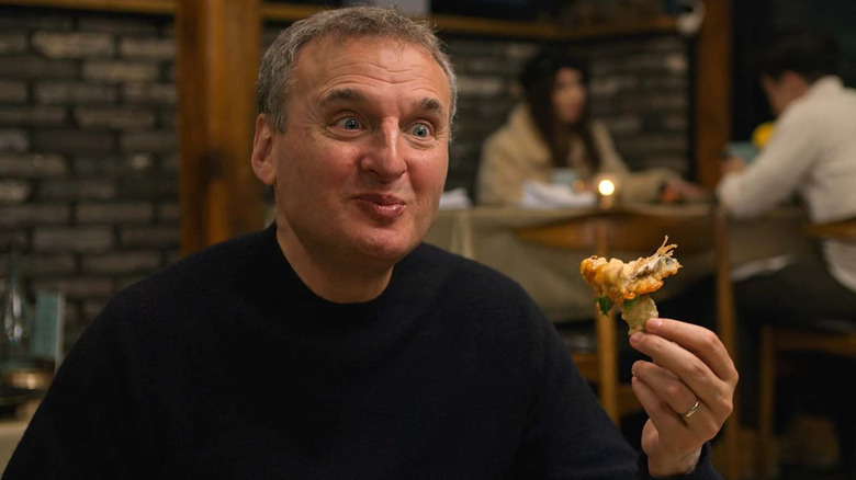 Phil Rosenthal enjoys shrimp