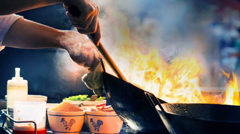 Food is prepared in a wok