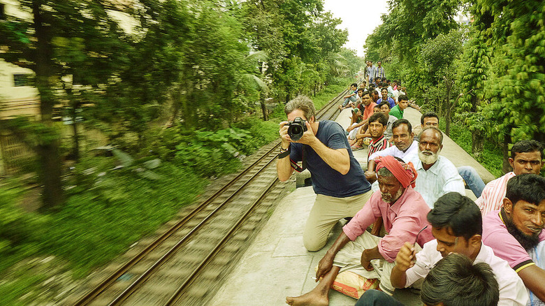 A photographer on a train in India