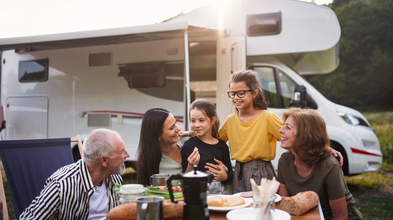 Family picnic by RV