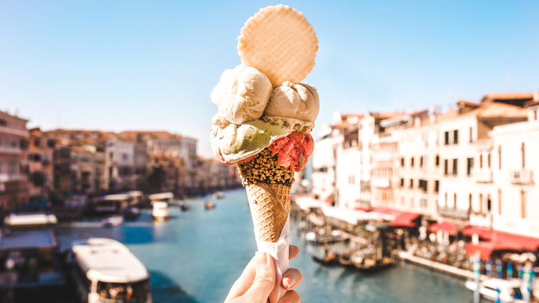 Woman holding ice cream in Venice