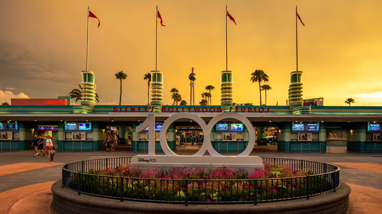 Hollywood Studios with the 100 statue