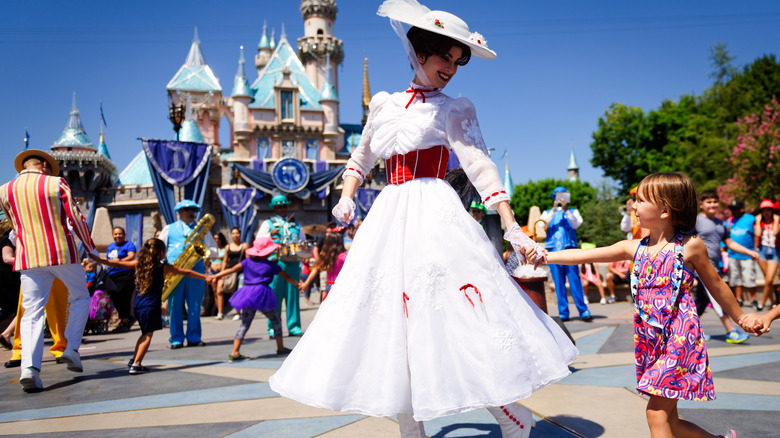 Mary Poppins with a child at Disney