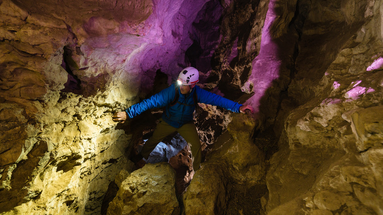 spelunker navigating a cave