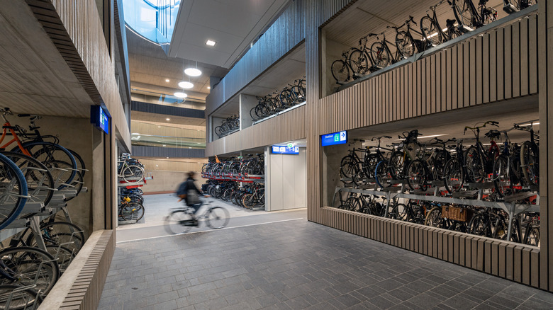 A cyclist enters a bicycle garage in Utrecht