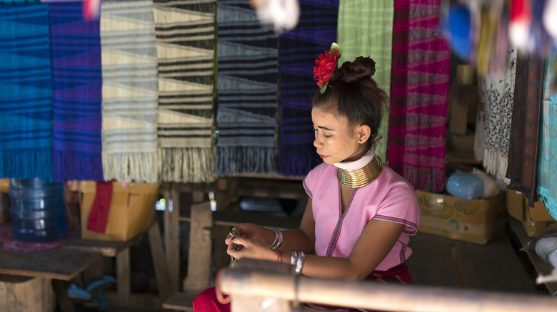 A Kayan woman making handicrafts