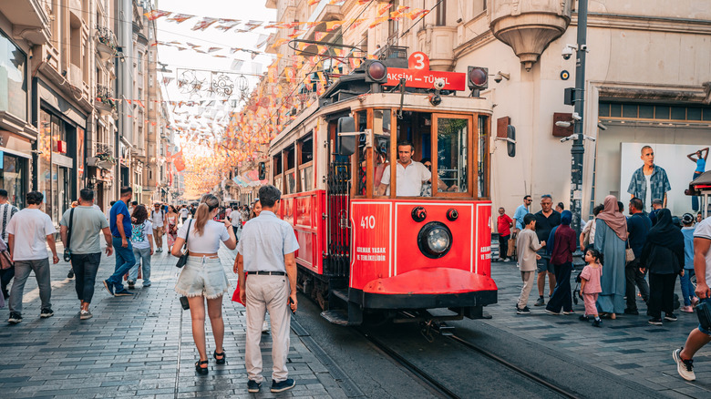 A tramway crosses through the pedestrian boulevard in Beyoğlu