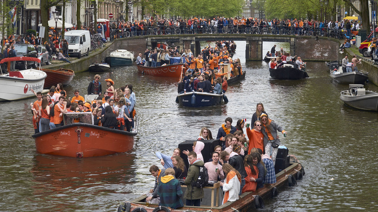 people wearing orange in canal boats