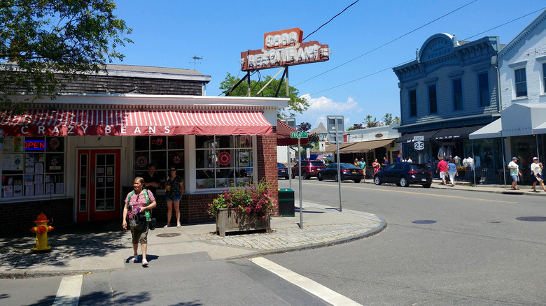 Tourists walking along street in Greenport