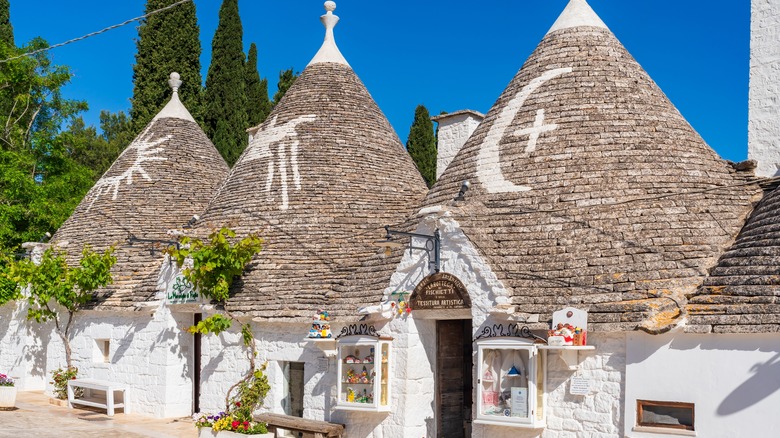 Pointed roofs with symbols in Alberobello, Italy