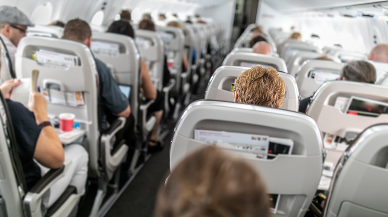 Passengers in plane cabin