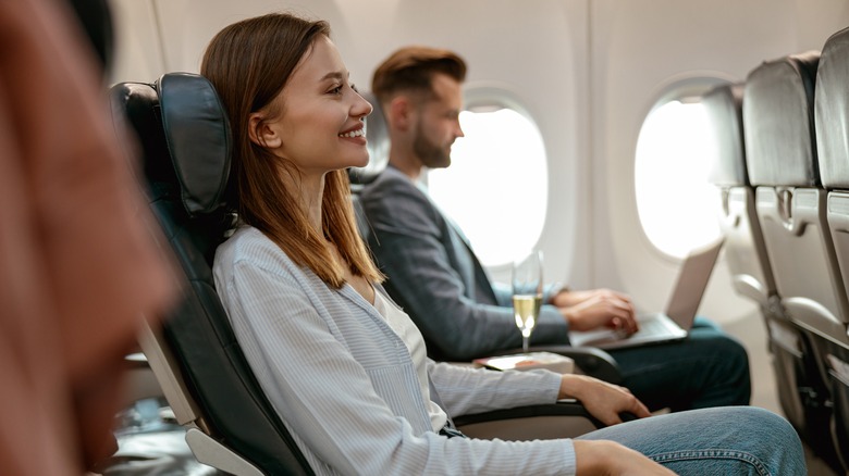 Passengers in plane seats
