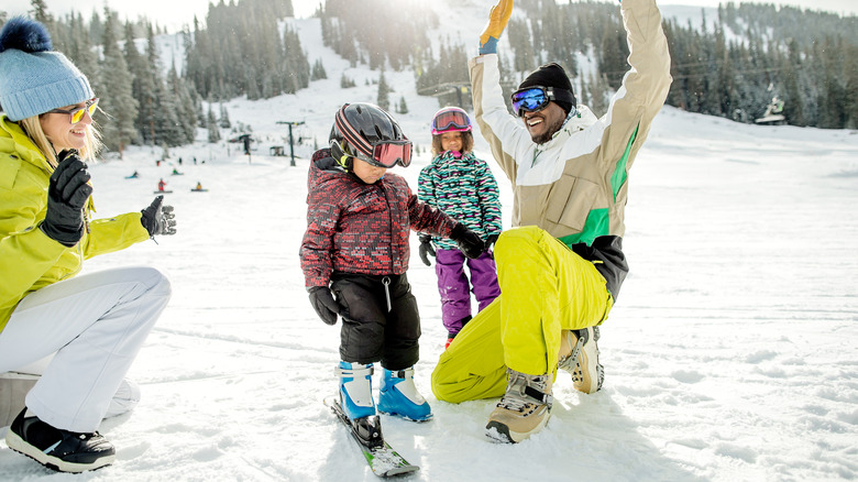 A family enjoying the day skiing