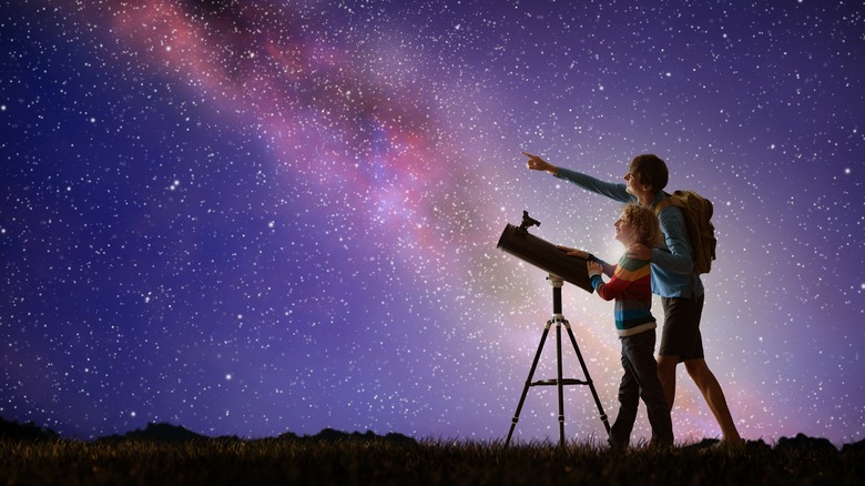 people stargazing with telescope