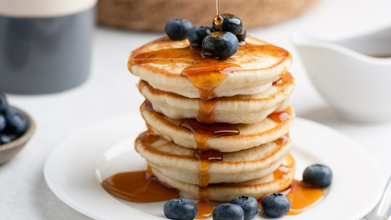 Delicious pancake stack with syrup and blueberries