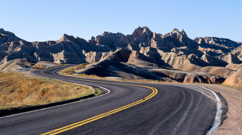 A road winding through rock formations at Badlands National Park, South Dakota