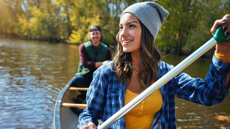 couple canoeing on a lake