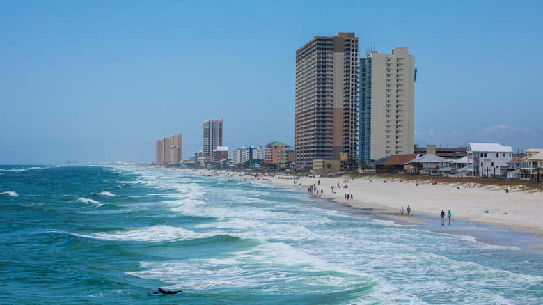 Tall buildings along sandy Panama City Beach, FL.