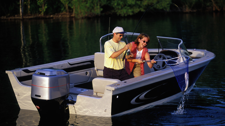 two people fishing on a lake