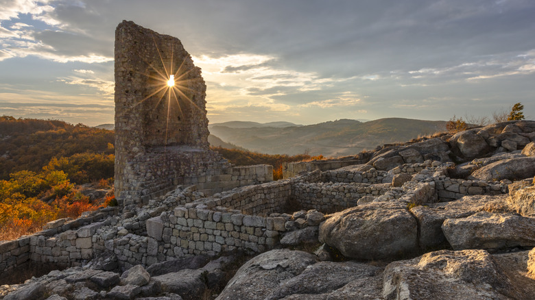 The medieval tower at the ancient ruins of Perperikon at sunset in autumn.