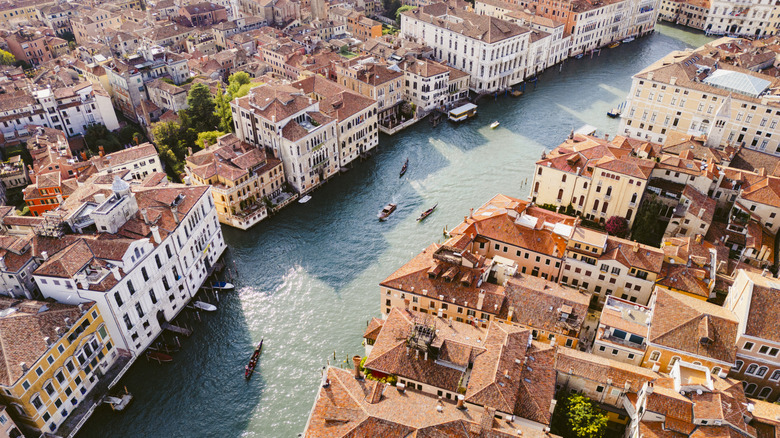 overhead shot of Venetian canal with Italian buildings