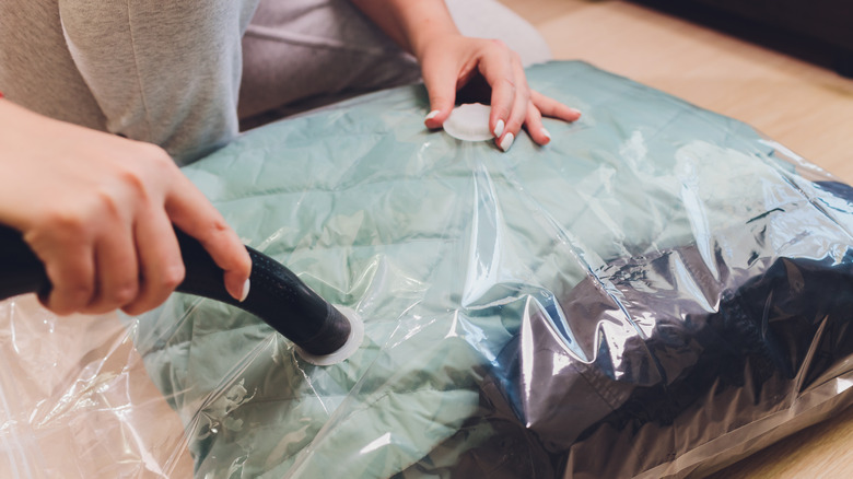 woman using space-saver bag