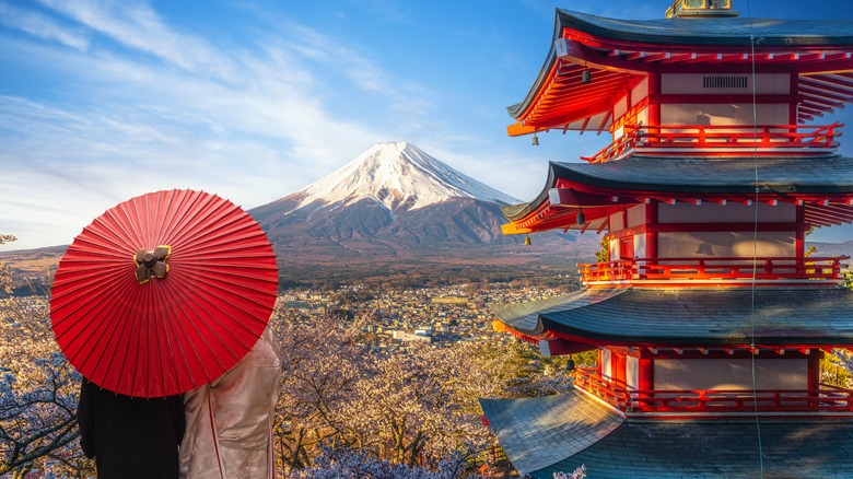 Couple looking at Mount Fuji in Japan with a pagoda in the foreground