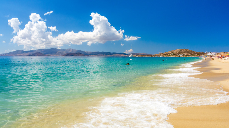 endless golden sand, ocean, and clouds